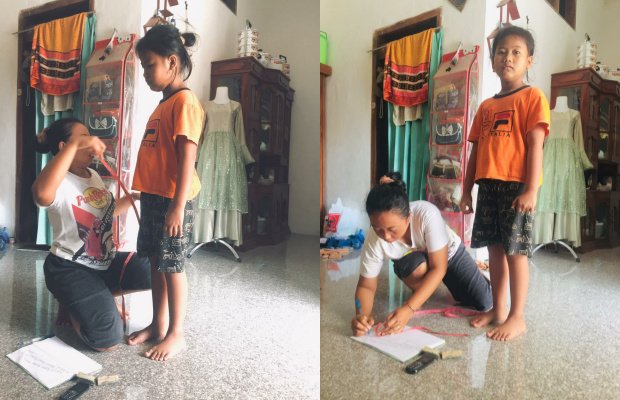 Foto: Syafika Auliyak, salah satu siswi MI An-Nur saat melakukan pengukuran baju seragam ke penjahit lokal