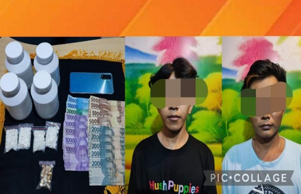 Foto : dua tersangka berikut barang bukti