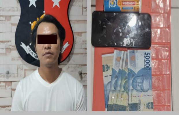 Foto: Tersangka bersama barang buktinya saat di amankan polisi